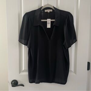 Feminine black top. V-neck with short flowing sleeves. Perfect staple item.